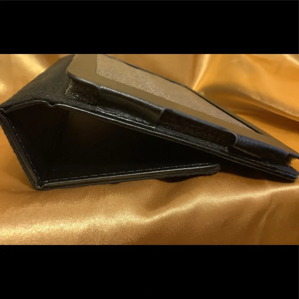 Black tablet cover, Magnetic closure, Measures @ 7 1/2” x 5”, NWT